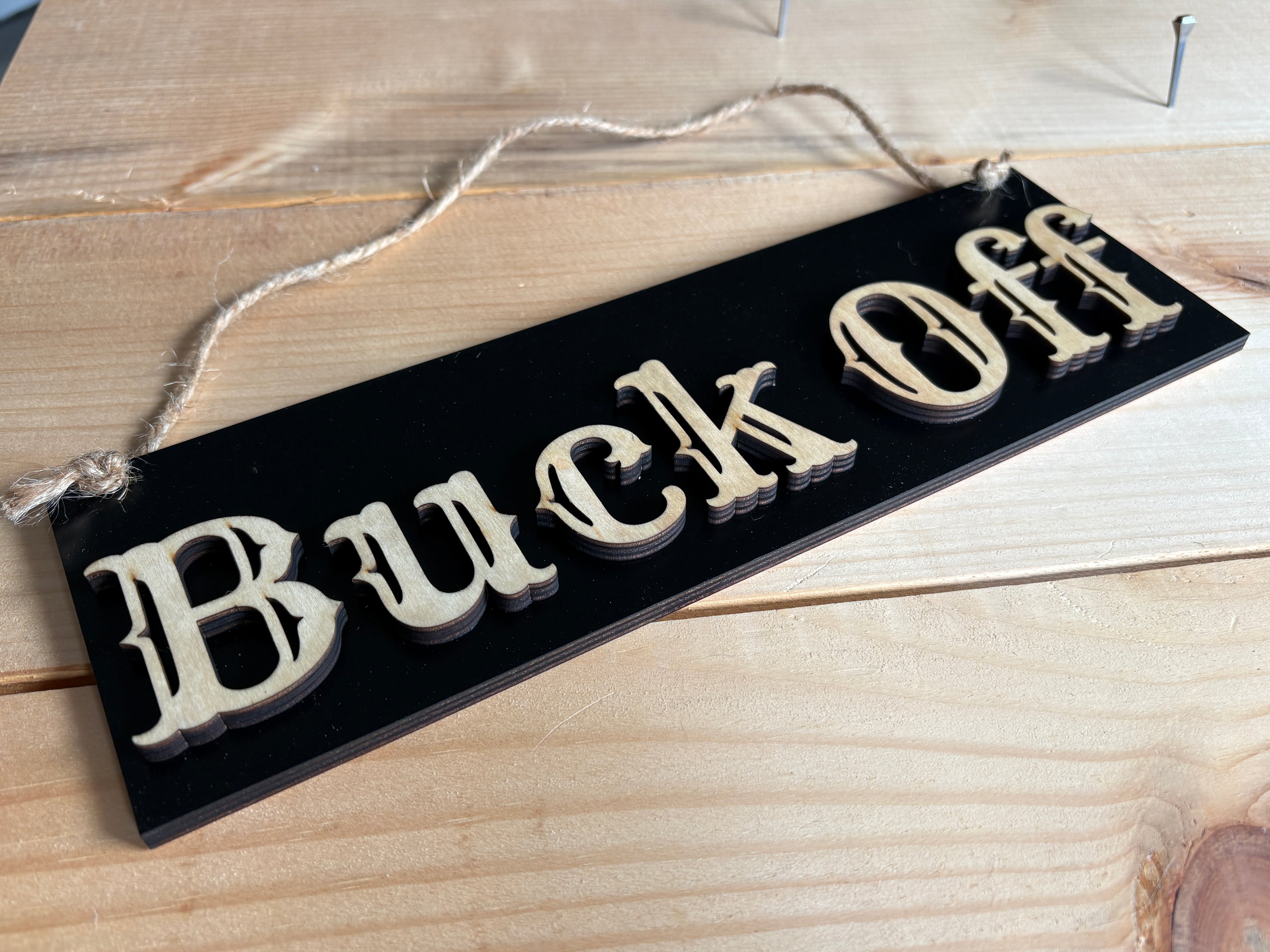 Buck Off sign