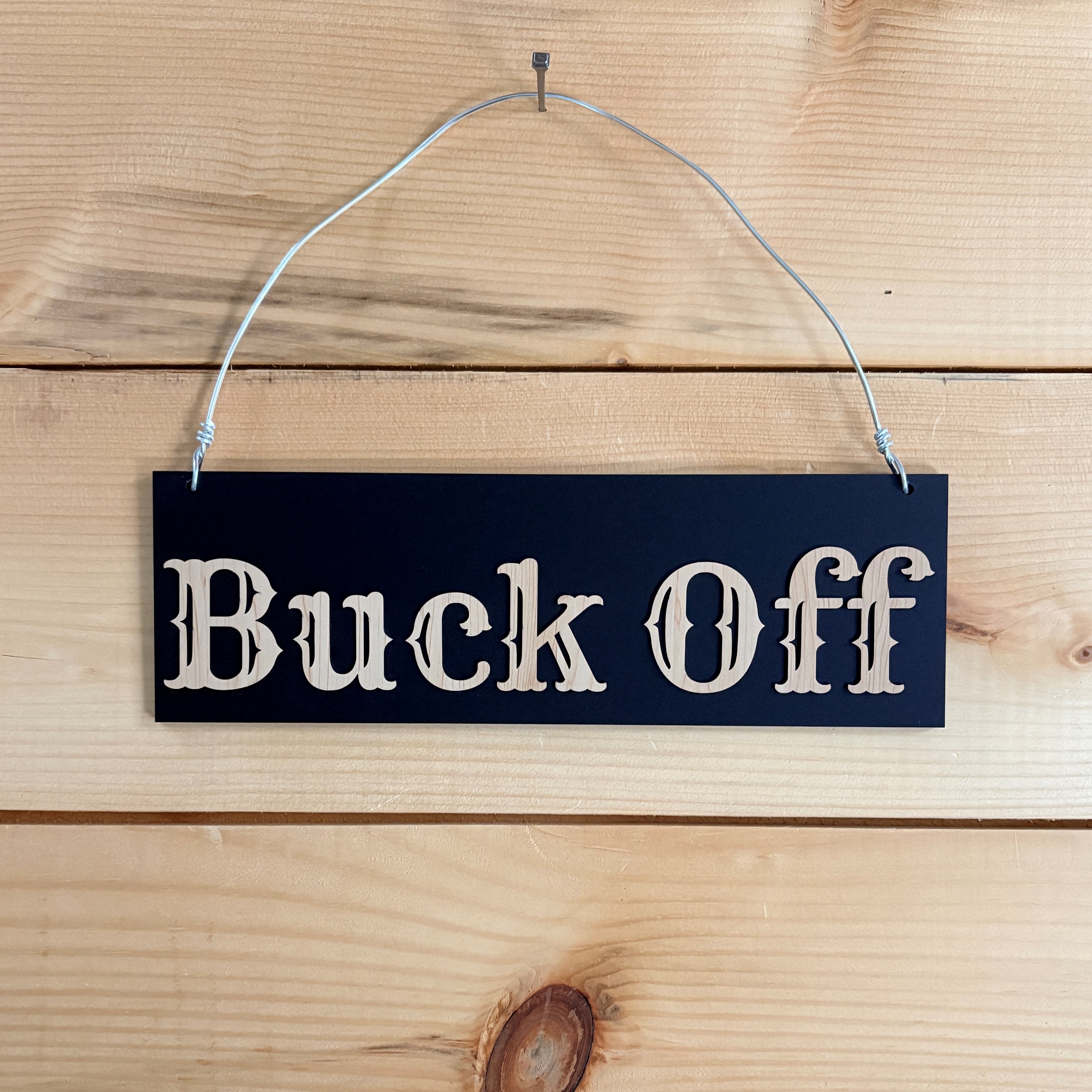 Buck Off sign