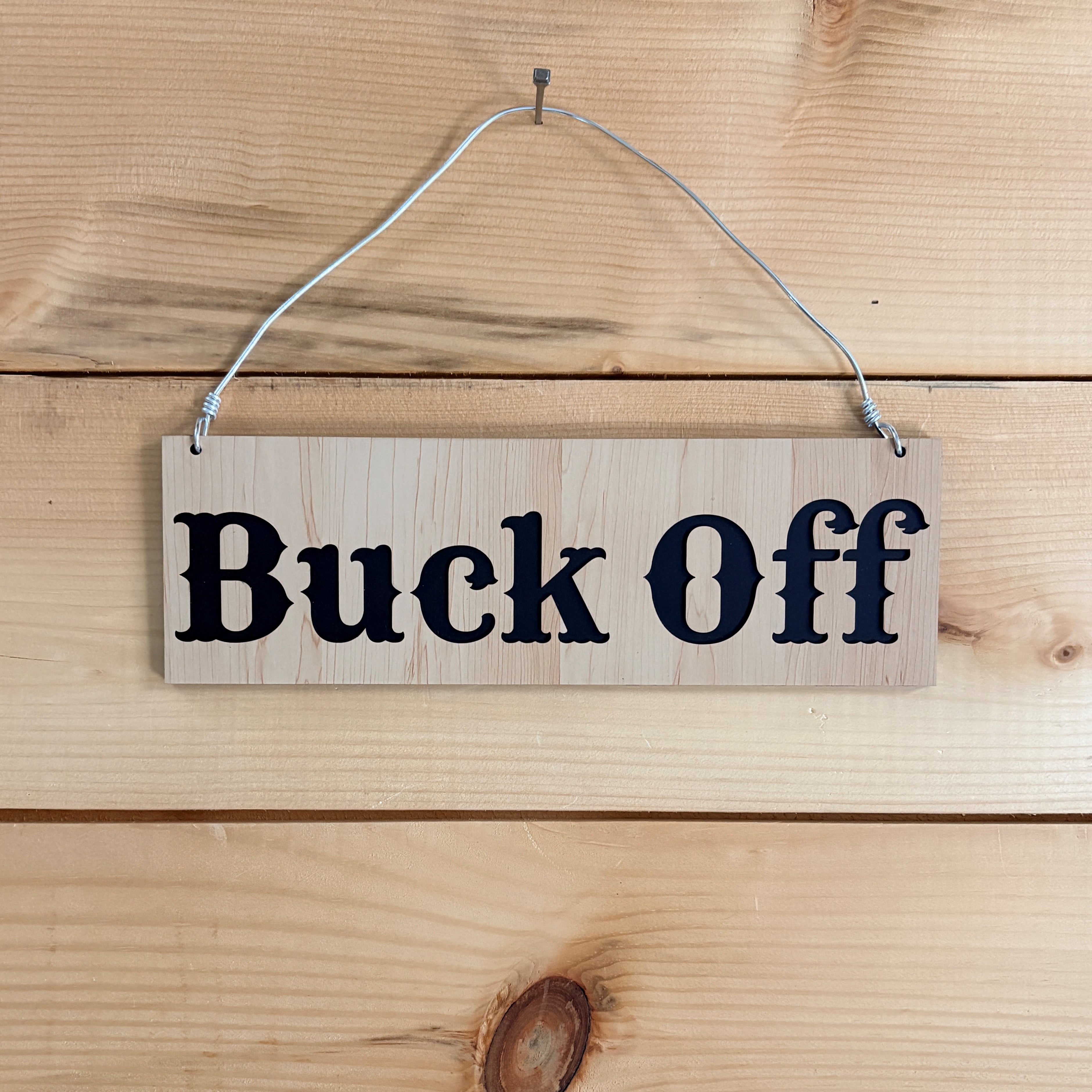 Buck Off sign
