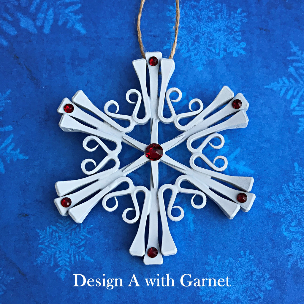 horseshoe nail snowflake ornament painted white with January Garnet Crystals